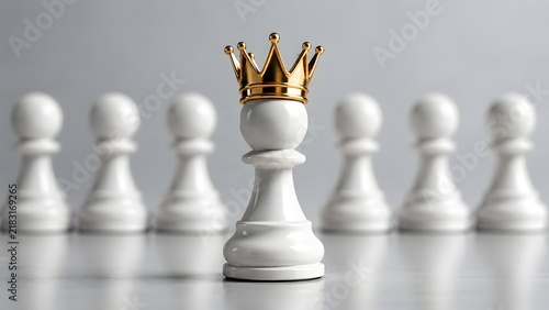 Golden crown on white chess pawn standing ahead of team symbolizing leadership business success authority strategy ambition achievement management competition and winning corporate vision concept