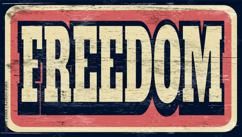 Retro aged freedom sign on wood