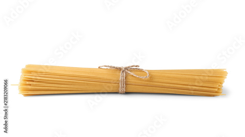 Fotografía Tasty raw spaghetti pasta on white background
