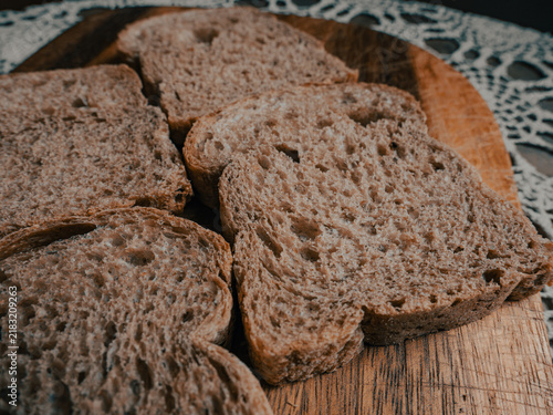 Obraz na płótnie Four Wholegrain Bread Slices Arranged in Cross Pattern, Top-Down Crumb Texture D