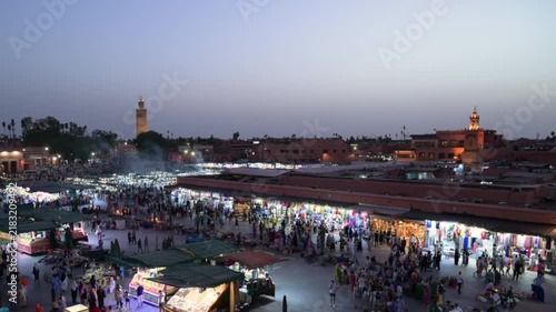 Marrakech, morocco. August 9, 2026. Bustling night market at djemaa el fna square in marrakech, morocco. Crowds of people and tourists walking among food stalls and shops