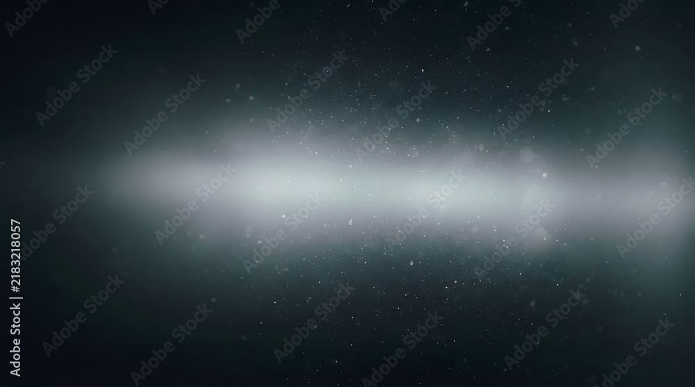 Fototapeta premium Abstract light flare with floating dust particles on a dark background