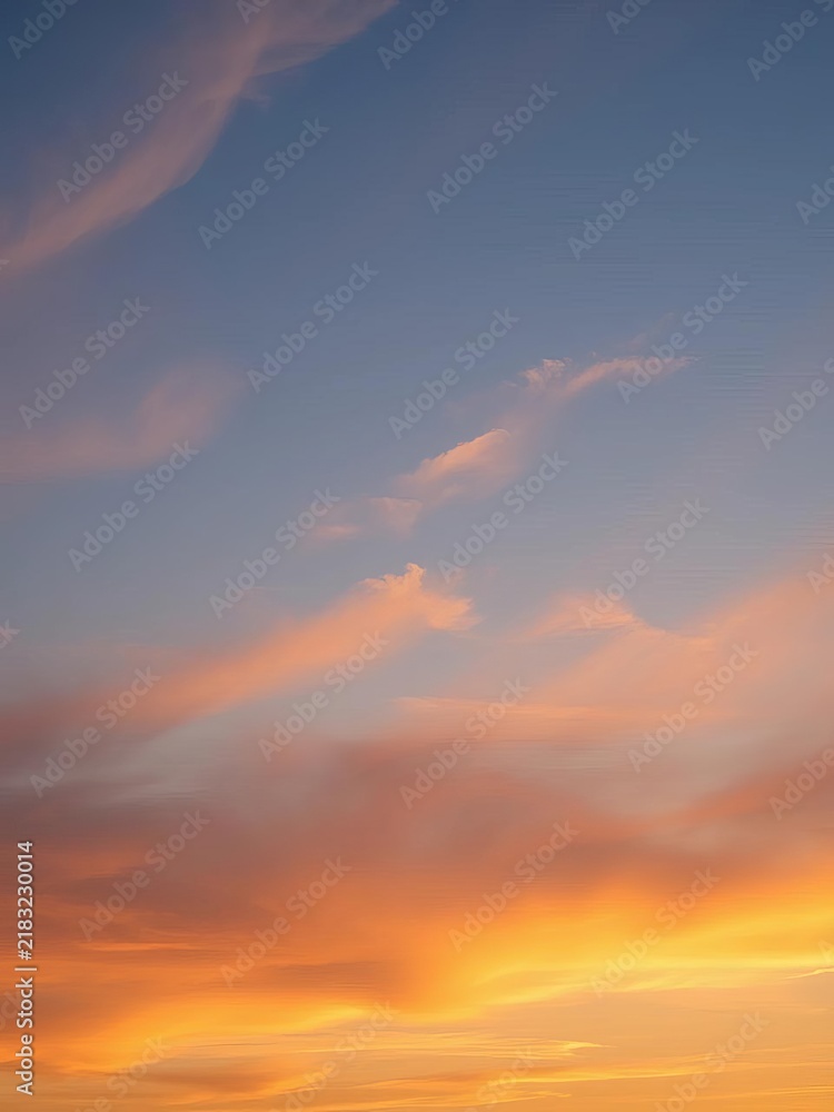 Fototapeta premium Warm sunset sky with wispy clouds and gentle blue hue, peaceful, || sky