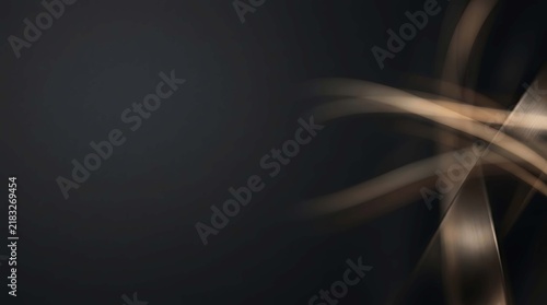 Abstract background with flowing golden light streaks on a dark surface