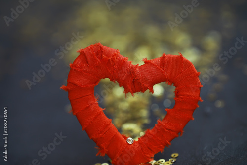 Obraz na plátně Rustic Red Fabric Heart with Golden Sequins on Dark Background for Romantic or C