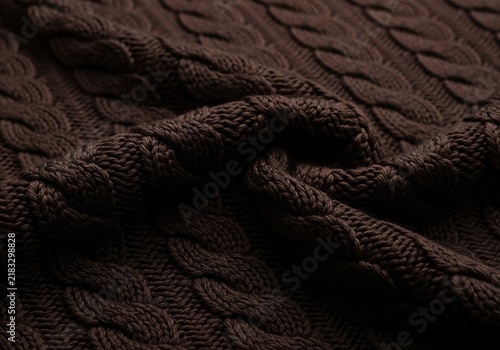 Dark Brown Cable Knit Sweater Fabric Texture Background.