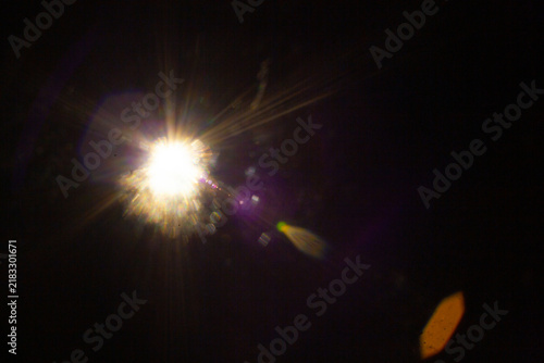 Sun flare on the black background