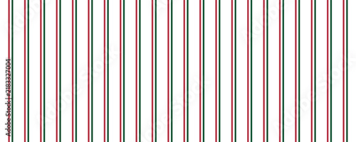 Green and red lines cross each other in rhombus shape. Christmas pattern background.