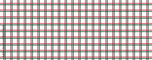 Green and red lines cross each other in rhombus shape. Christmas pattern background.