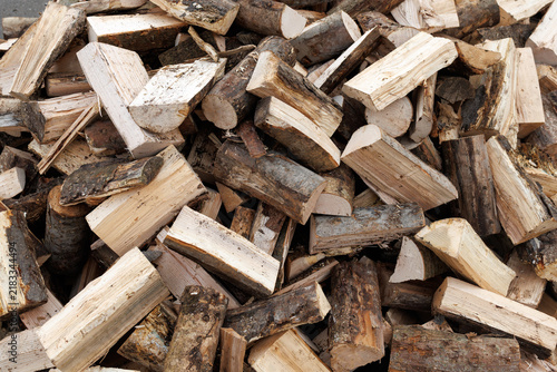 Large Pile of Chopped Firewood Logs Ready for Storage or Winter