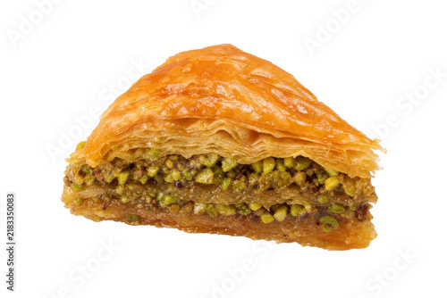 Bild auf Leinwand Delicious golden triangular baklava pastry filled with vibrant green pistachios,