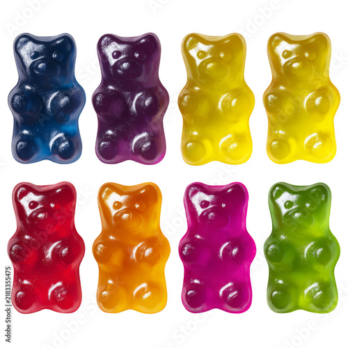 Colorful gummy bear candy arranged in two rows featuring glossy red blue purple yellow orange pink and green confectionery shapes on transparent background