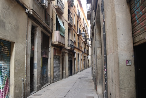 Fotografie Narrow street in Barcelona, Catalonia, Spain.