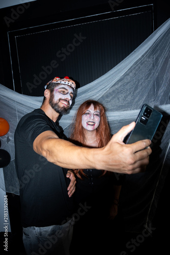 Friends taking a selfie at a Halloween party