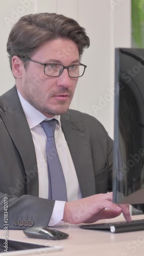 Busy Young Businessman Working on Computer, Vertical Video