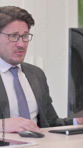 Young Businessman Reacting to Loss While Working on Computer, Vertical Video