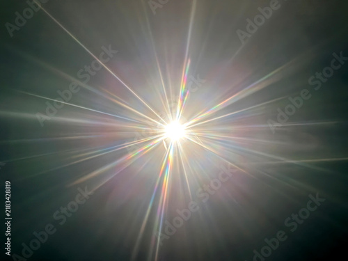 Bright starburst light effect with colorful spectral lens flares