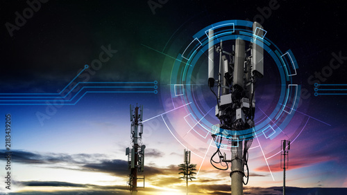 Telecommunication towers against a sunset sky with digital graphic overlays representing 5G wireless network, connectivity, and futuristic. Concept of communication network and connection technology