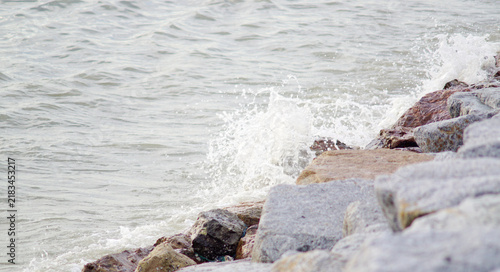 Waves in the sea crash against the rocks