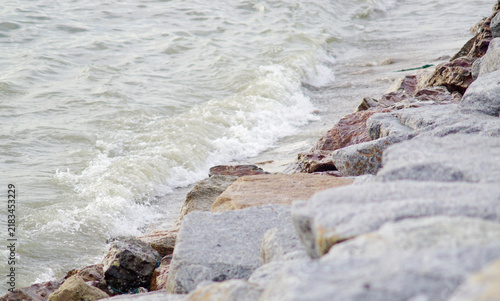 Waves in the sea crash against the rocks