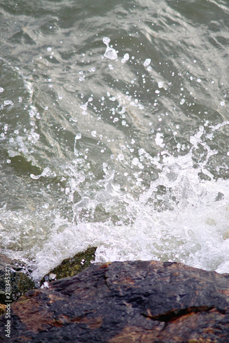 Splashing sea surf crash against the rocks, Nature background