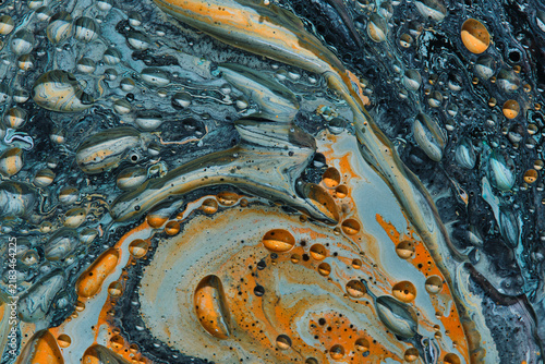 Fotografía Mesmerizing fluid art pattern showcasing orange, grey, and teal swirls with round oil bubbles