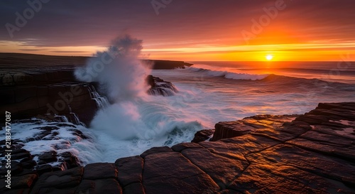 Sunset over mountain landscape with clouds