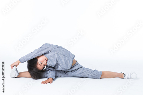 Принти на полотні Boy doing yoga stretch in wide straddle pose