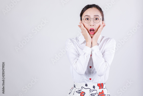 Картината върху платно Woman in surprise with hands on cheeks and wide-eyed expression
