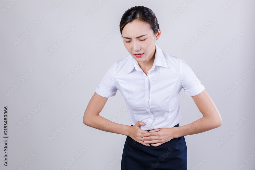 Obraz premium Distressed Woman Clutching Stomach in Pain