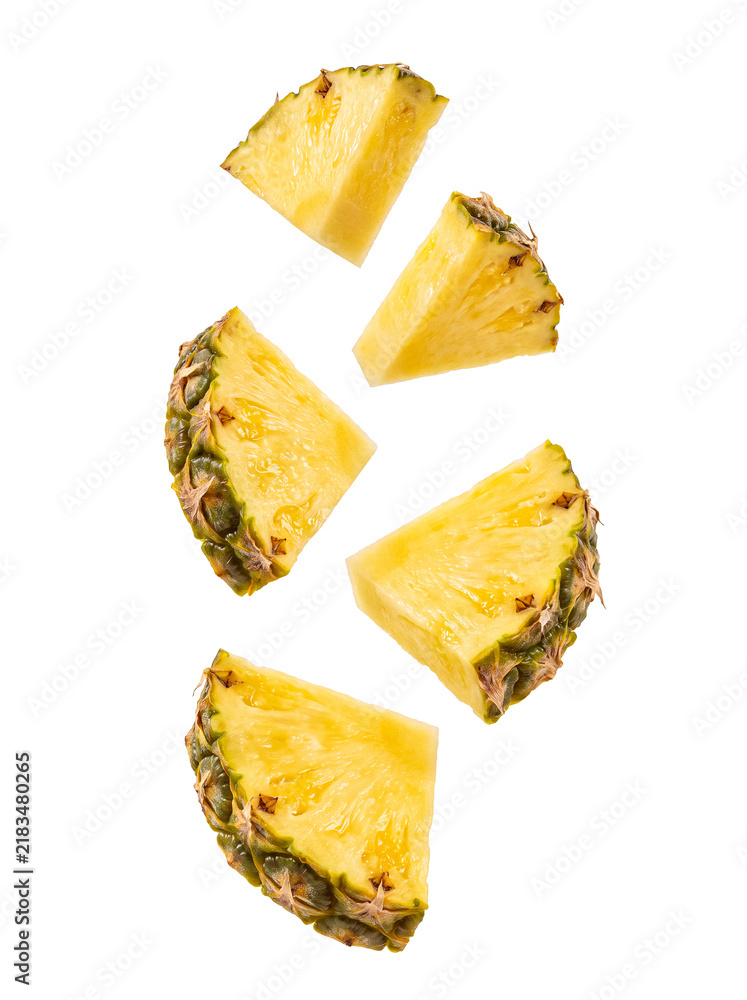 Obraz premium Fresh ripe pineapple slices and wedges falling and floating in the air, isolated on transparent background.