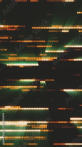 Glowing yellow and green LED dot matrix lines with light rays creating a dynamic digital rhythmic background.
