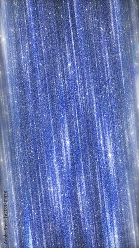 Vibrant blue shimmering metallic texture with sparkling diagonal rain. Glamorous and festive luxury abstract background.