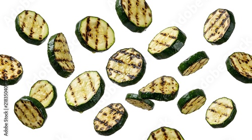 Grilled zucchini slices flying in the air, a healthy and delicious food