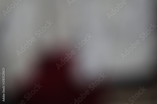 Abstract dark grey and red blurred background with soft light gradients