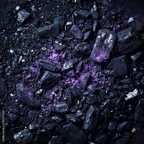 Macro texture of crushed black graphite and coal with subtle glowing neon purple dust, highly tactile background, deep natural contrast