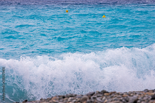 Fotografie Natural background of a blue, restless sea with waves