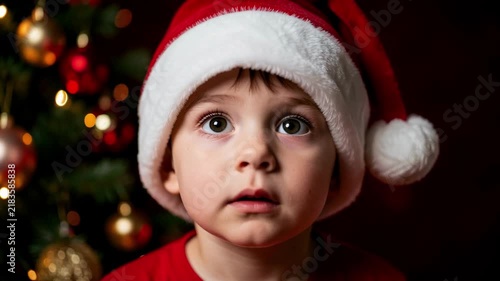 Child in Santa Hat with Christmas Lights.