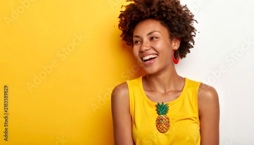 Happy black woman laughing wearing pineapple brooch