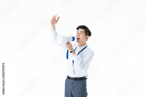 Cuadro en lienzo Young male tour guide speaking through megaphone and waving on white