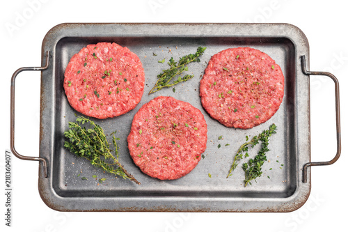 Fotografía Raw hamburger minced meat patties  for burgers with herbs on tray isolated on wh