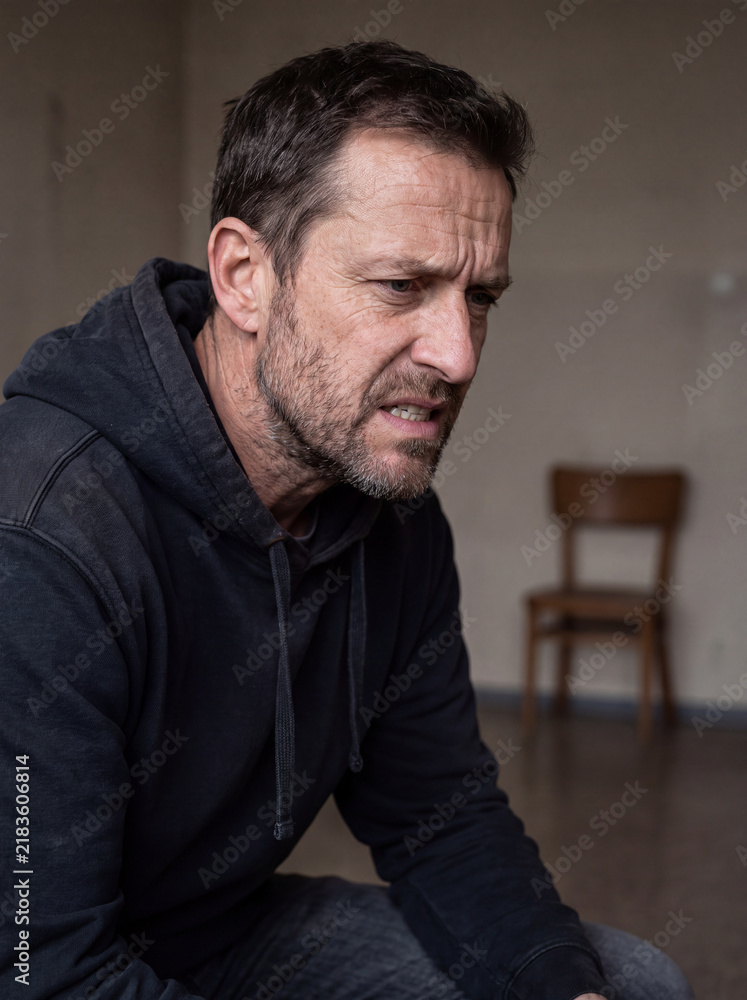 Fototapeta premium Angry Man Experiencing Emotional Stress and Irritability