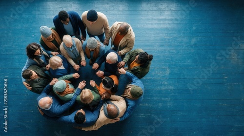 Diverse Group Forms Circle Holding Hands In Unity And Support