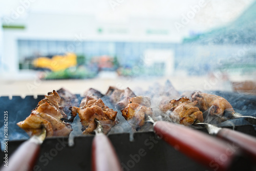 Fresh meat and food in the foreground with agricultural machinery in the background, representing the connection between farming, food production, livestock agriculture, and modern agricultural techno