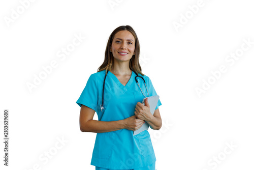 Confident female healthcare worker smiling holding notes