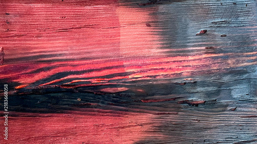 Принти на полотні Red and blue-gray toned weathered wood with rough wavy grain and a dark rustic f