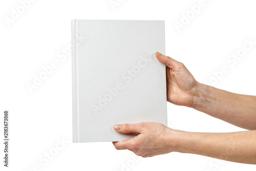 Two hands holding a blank white vertical book cover for mockup display isolated on a transparent background