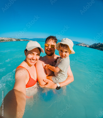 Family swimming together in Adriatic sea