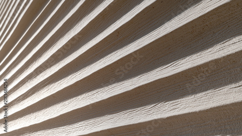 Textured vinyl siding with shallow grooves and lines in sunlight  