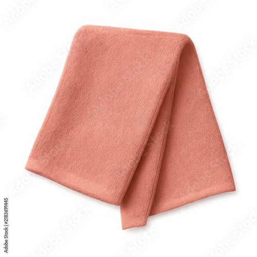 Coral colored soft folded towel, bath or hand towel isolated on white for bathroom and spa concepts.